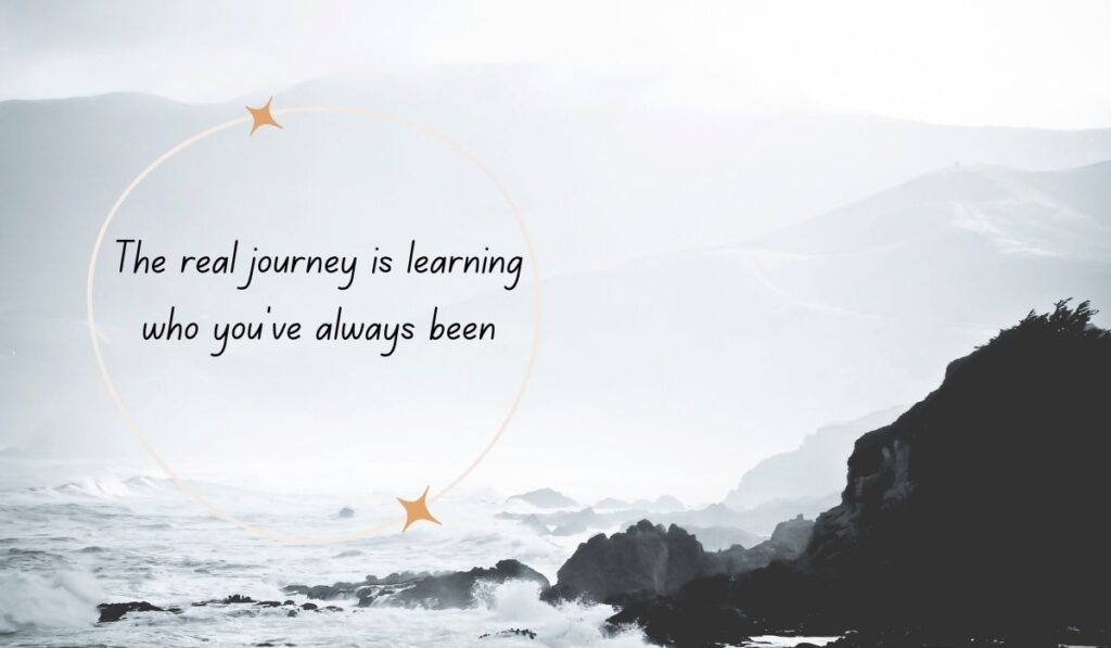 Dramatic black and white coastal ocean view with waves crashing against rocks, framed by a soft gold circle containing the text, "The real journey is learning who you've always been"