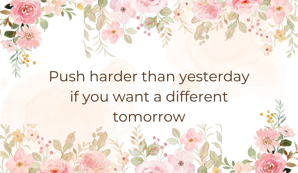 Elegant white card decorated with soft pink watercolor flowers and green leaves along the top and bottom borders, highlighting some of the best motivational quotes for athletes that read, "Push harder than yesterday if you want a different tomorrow".