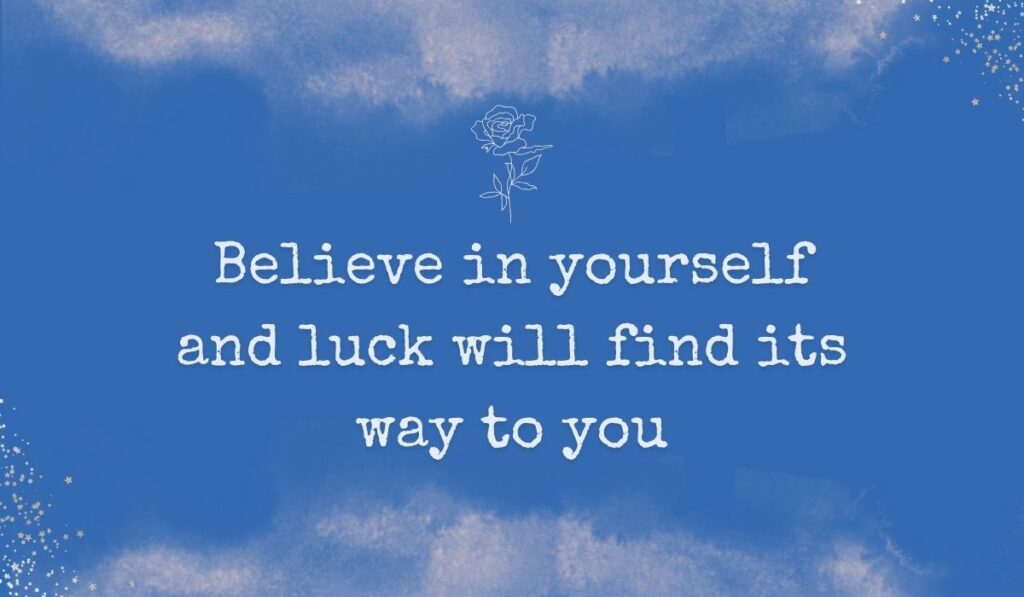 Rich royal blue watercolor background with subtle stardust detailing in the corners and a fine white line-art rose centered at the top, framing handwritten best quotes for good luck: "Believe in yourself and luck will find its way to you".