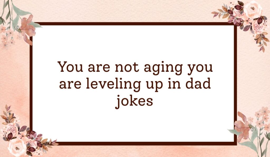 Classic white rectangular card with a dark brown border set against a textured peach watercolor background with floral accents, highlighting humorous birthday wishes for a guy funny: "You are not aging you are leveling up in dad jokes".