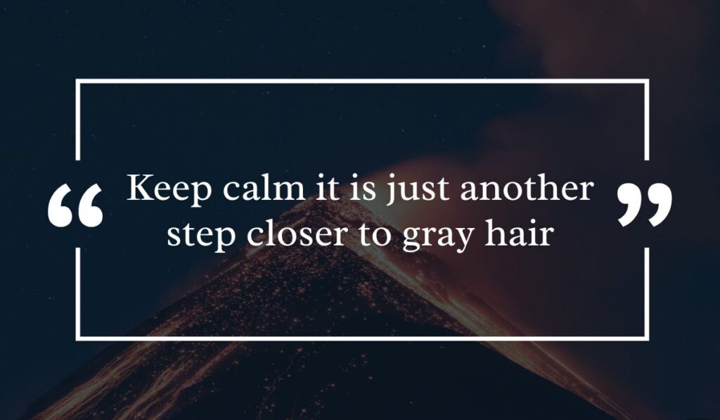 Dramatic dark night sky background featuring a lit volcanic peak at night, centered with a white quotation box highlighting lighthearted birthday wishes for a guy funny: "Keep calm it is just another step closer to gray hair".