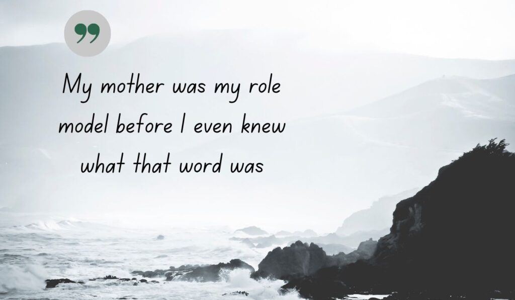 Atmospheric black and white coastal image of crashing ocean waves against rocky cliffs, centered with a thin, delicate gray circle and a dark green quotation icon framing the handwritten literary text, "My mother was my role model before I even knew what that word was".