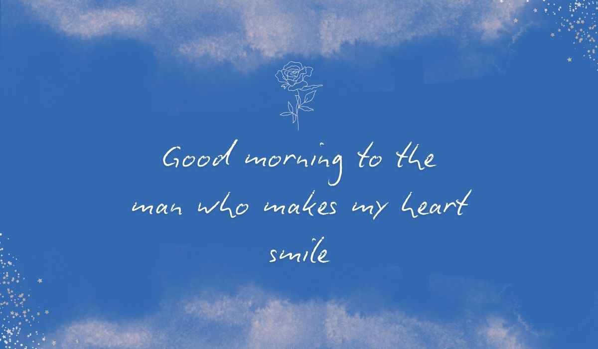 Rich royal blue watercolor background with subtle stardust detailing in the bottom corners and a fine white line-art rose centered at the top, framing the elegant handwritten sentiment, "Good morning to the man who makes my heart smile".