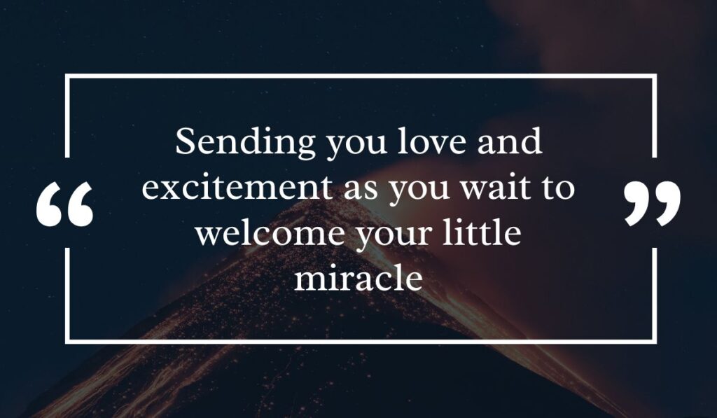 Dramatic dark night sky background featuring a lit volcanic peak at night, centered with a white quotation box highlighting excited messages for baby shower card: "Sending you love and excitement as you wait to welcome your little miracle".
