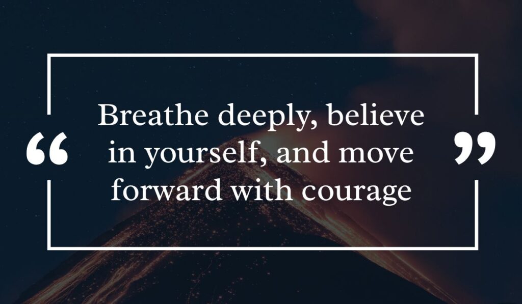 Dramatic dark night sky background featuring a lit volcanic peak at night, centered with a white quotation box highlighting motivational positive messages for the day: "Breathe deeply, believe in yourself, and move forward with courage".