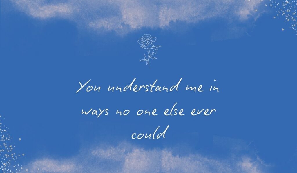 Rich royal blue watercolor background with subtle stardust detailing in the bottom corners and a fine white line-art rose centered at the top, framing the elegant handwritten sentiment, "You understand me in ways no one else ever could".