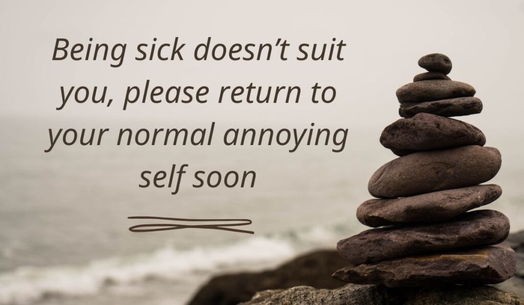 Serene coastal landscape background featuring a stack of balanced rocks in cairn formation, highlighting lighthearted funny get well soon messages: "Being sick doesn't suit you, please return to your normal annoying self soon".