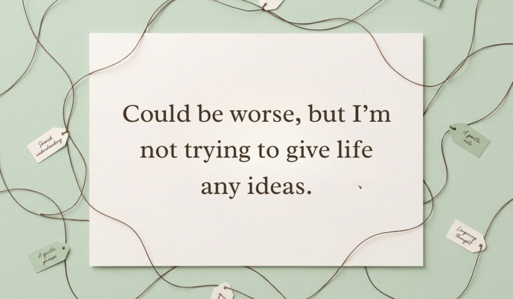 Light green background with crisscrossing twine loops and mini tags presenting a witty choice for how to reply to how's it going reading, "Could be worse, but I’m not trying to give life any ideas."