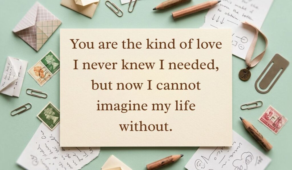 Mint green flat lay with vintage stamps and paper clips displaying long paragraphs for him reading, "You are the kind of love I never knew I needed, but now I cannot imagine my life without."