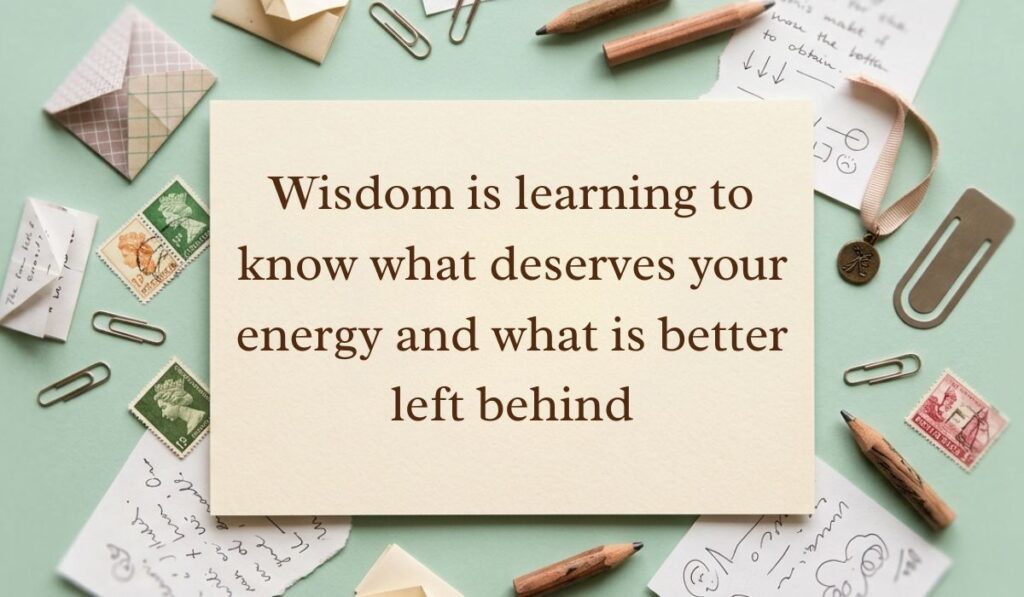 Soft mint green vintage desk layout with scattered postage stamps, envelopes, and pencils featuring wisdom quotes reading, "Wisdom is learning to know what deserves your energy and what is better left behind"