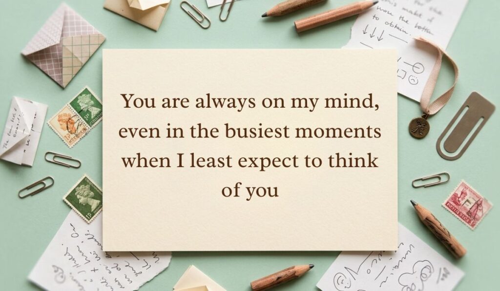 Sage green vintage desk layout with scattered paperclips, postage stamps, envelopes, and pencils featuring always on my mind quotes reading, "You are always on my mind, even in the busiest moments when I least expect to think of you"