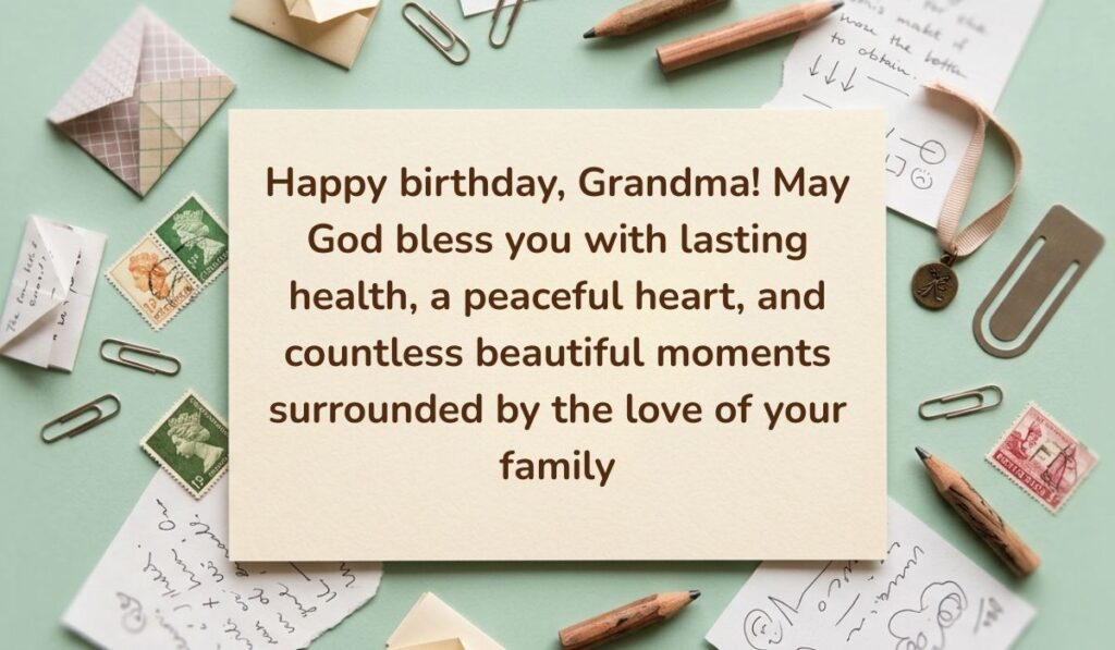 Sage green vintage desk layout with paperclips, postage stamps, envelopes, and pencils displaying Birthday Blessings for Grandmother reading, "Happy birthday, Grandma! May God bless you with lasting health, a peaceful heart, and countless beautiful moments surrounded by the love of your family"